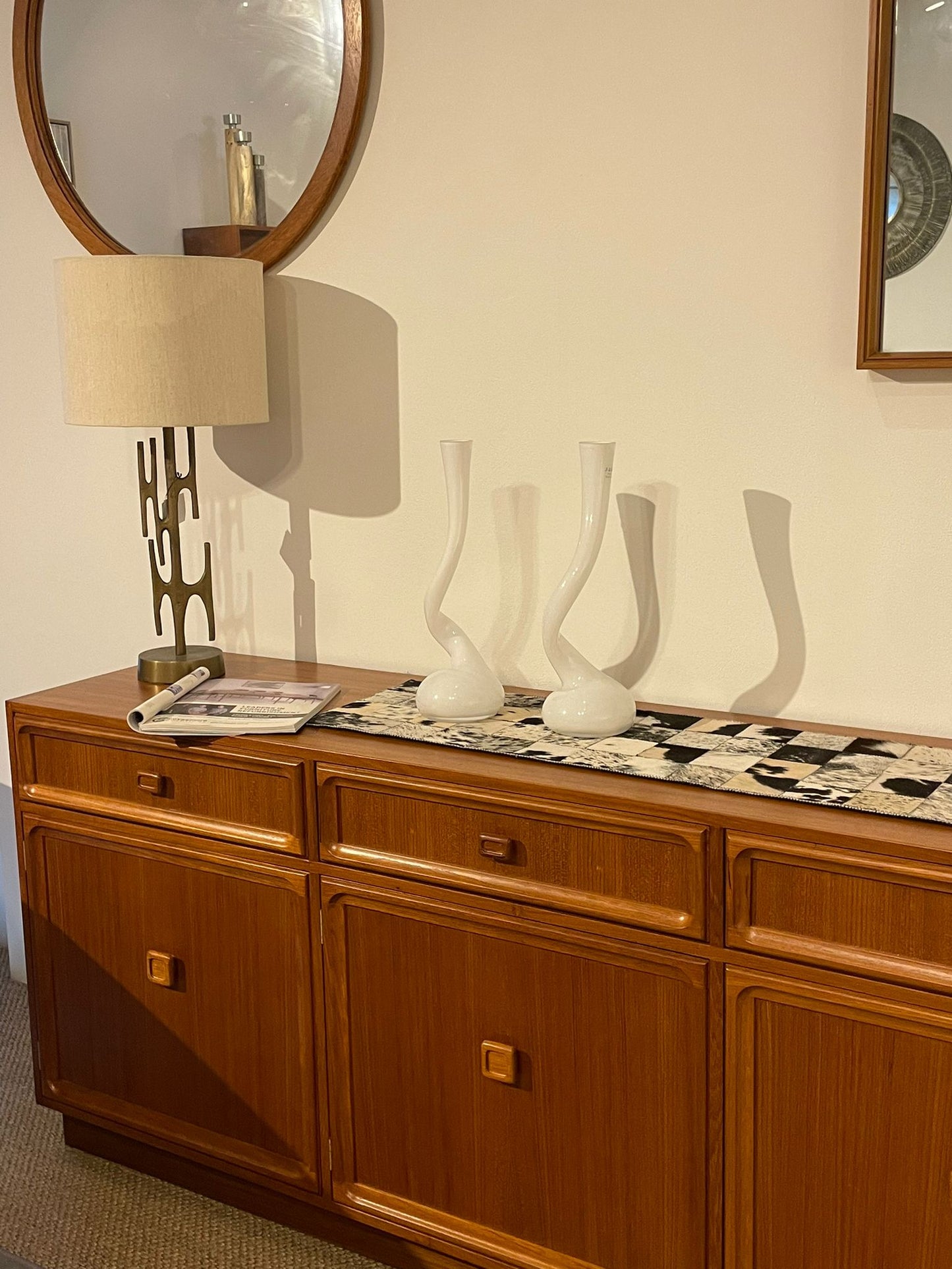 Parker Furniture Wooden sideboard, Teak Series 20, with decorative items against a wall with mirrors in Willoughby, Sydney. This parker furniture is for Sale.
