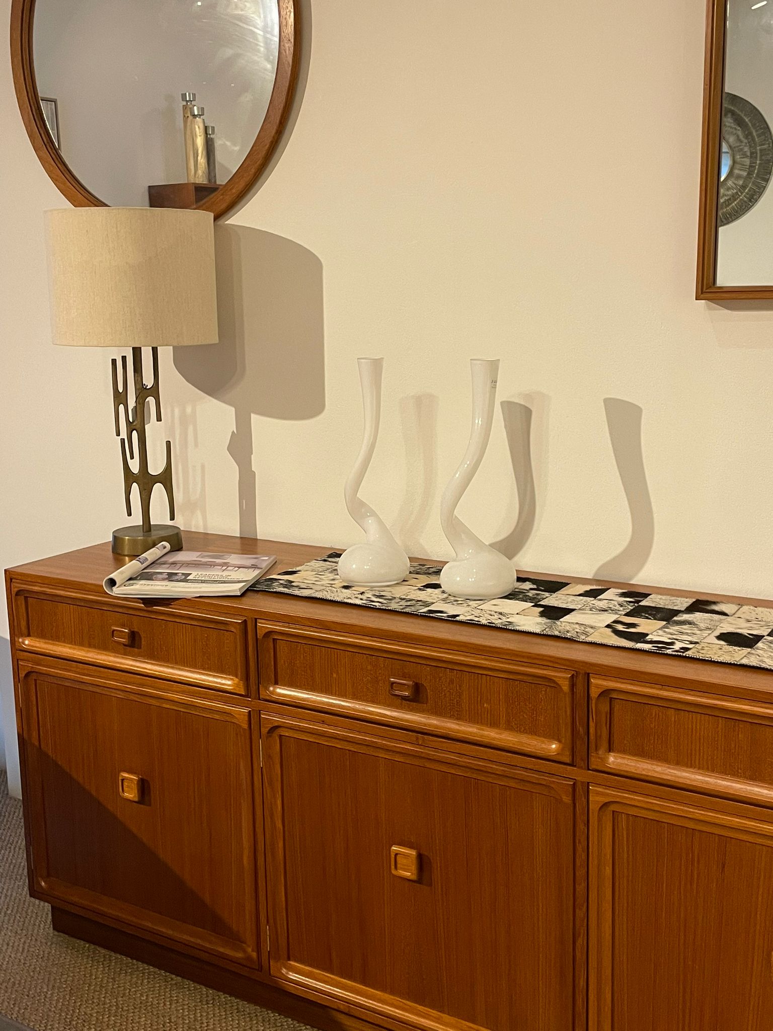 Parker Furniture Wooden sideboard, Teak Series 20, with decorative items against a wall with mirrors in Willoughby, Sydney. This parker furniture is for Sale.