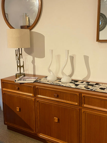 Parker Furniture Wooden sideboard, Teak Series 20, with decorative items against a wall with mirrors in Willoughby, Sydney. This parker furniture is for Sale.