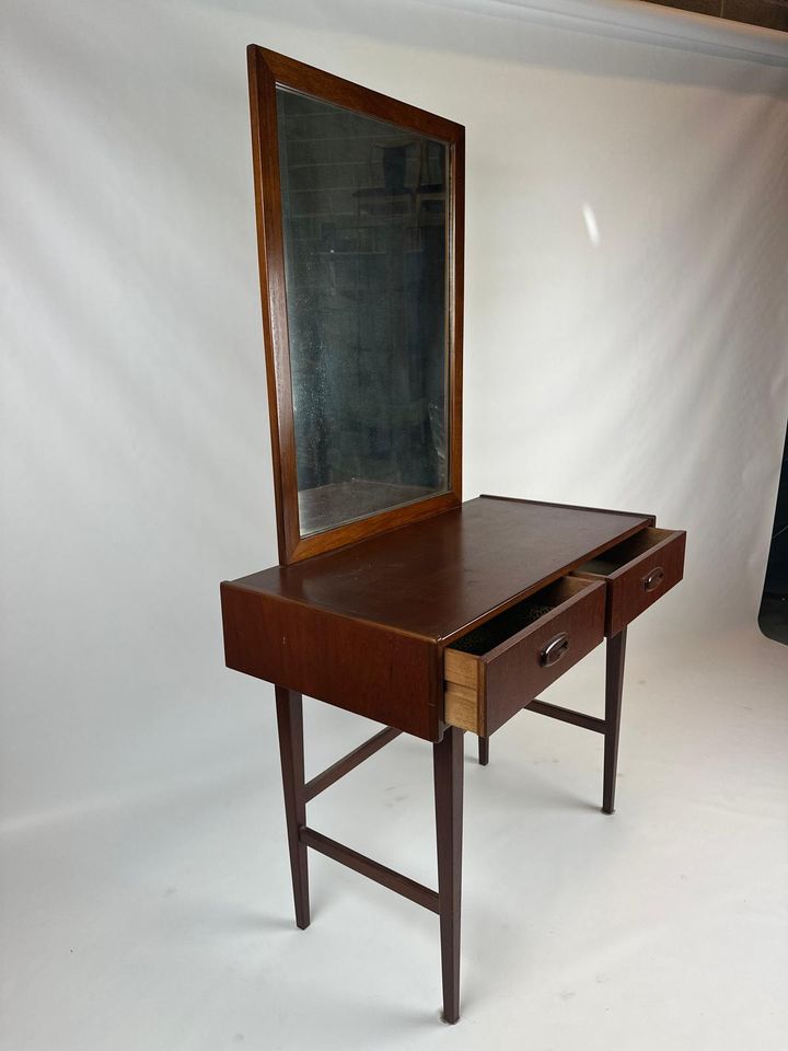 A Parker dresser from the 1960s with mirror against a plain background. Parker Furniture Available For Sale at Willoughby showroom.