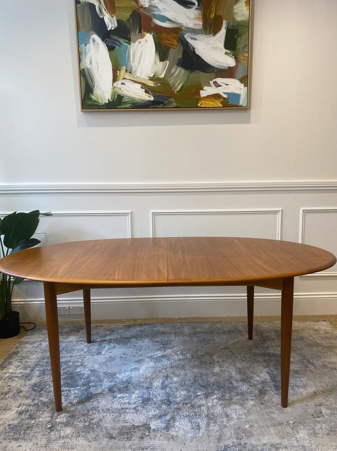 Australian mid-century Parker 91 dining table featuring tapered legs and double extension leaves.