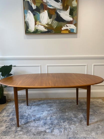 Australian mid-century Parker 91 dining table featuring tapered legs and double extension leaves.