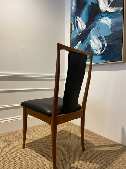 Back view of a Parker Dining chair, Model 60, elegant black leather and wood fully restored. This Parker furniture is for sale. Available for viewing in Willoughby.