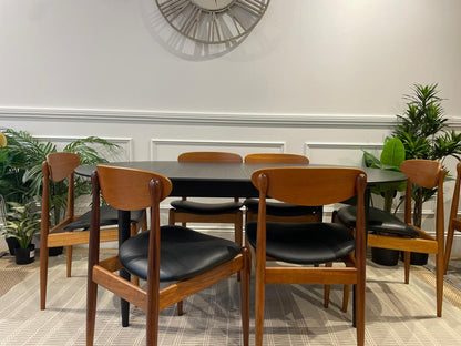 Parker dining chairs Model 107 and Parker oak table. Available for purchase at Sydney's Parker furniture showroom by Covesmore Solutions.