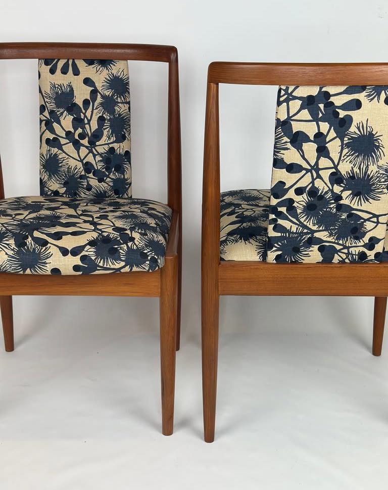 Two Parker, model 88, chairs with floral patterned cushions on a white background. Available for Sale 
