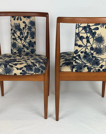 Two Parker, model 88, chairs with floral patterned cushions on a white background. Available for Sale 