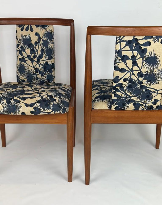 Two Parker, model 88, chairs with floral patterned cushions on a white background. Available for Sale 