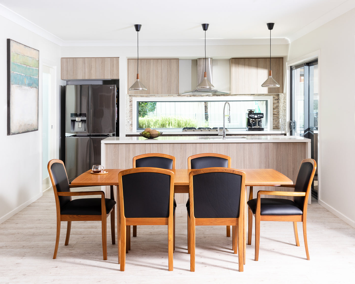 Restored Parker 83 dining table and Parker 92 dining chairs with custom upholstery in mid-century teak finish. Available online. Refurbishment by Ex Parker People™