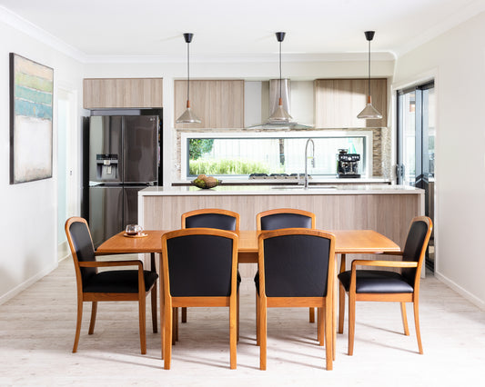 Restored Parker 83 dining table and Parker 92 dining chairs with custom upholstery in mid-century teak finish. Available online. Refurbishment by Ex Parker People™