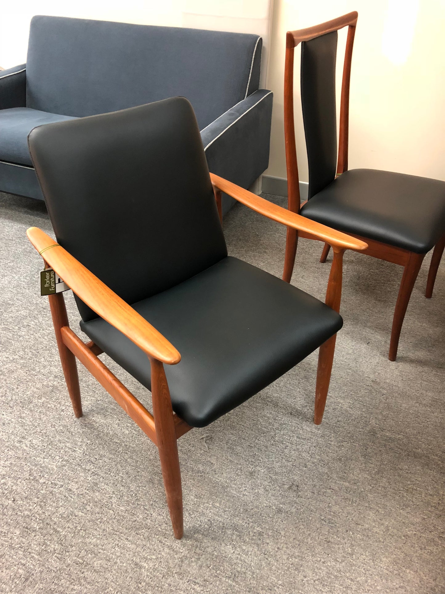 Black leather and teak restored, Model 119 available for purchase. Parker Furniture Brand. Refurbished by Expert Parker furniture restorers in Sydney, Covesmore Solutions.