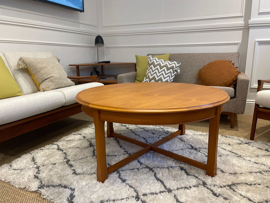 Parker wooden coffee table in a living room with a sofa and decorative pillows. Part of parker furniture for sale in Sydney showroom.