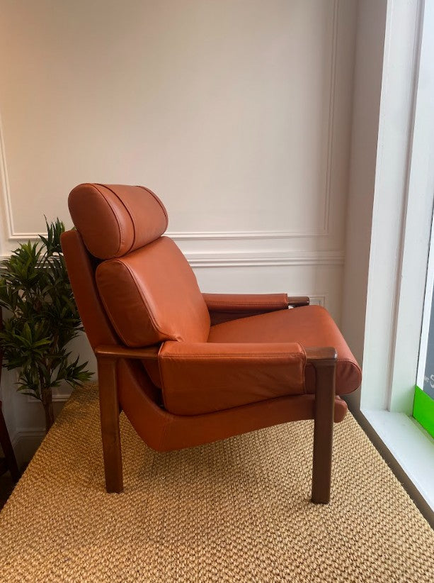 Tessa armchair, reupholstered in leather, available for purchase at covesmore solutions in Sydney.