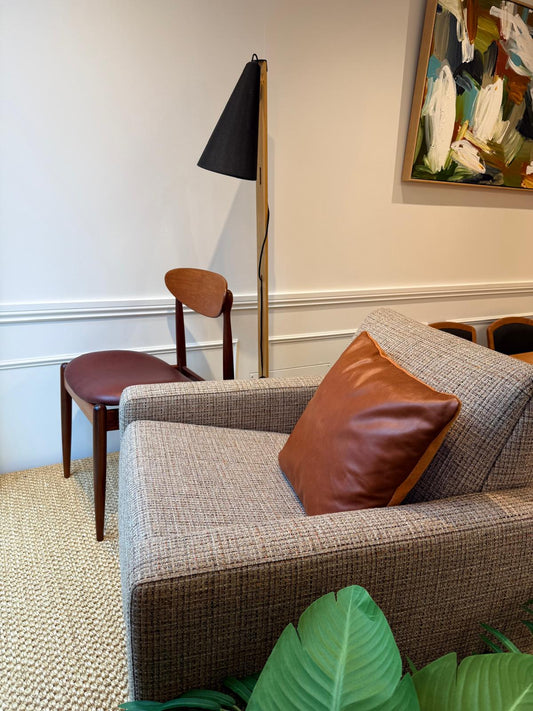 Parker 131 "Claremont" armchair and a Parker 107 chair reupholstered in leather. These Parker furniture are available for Sale in Sydney.