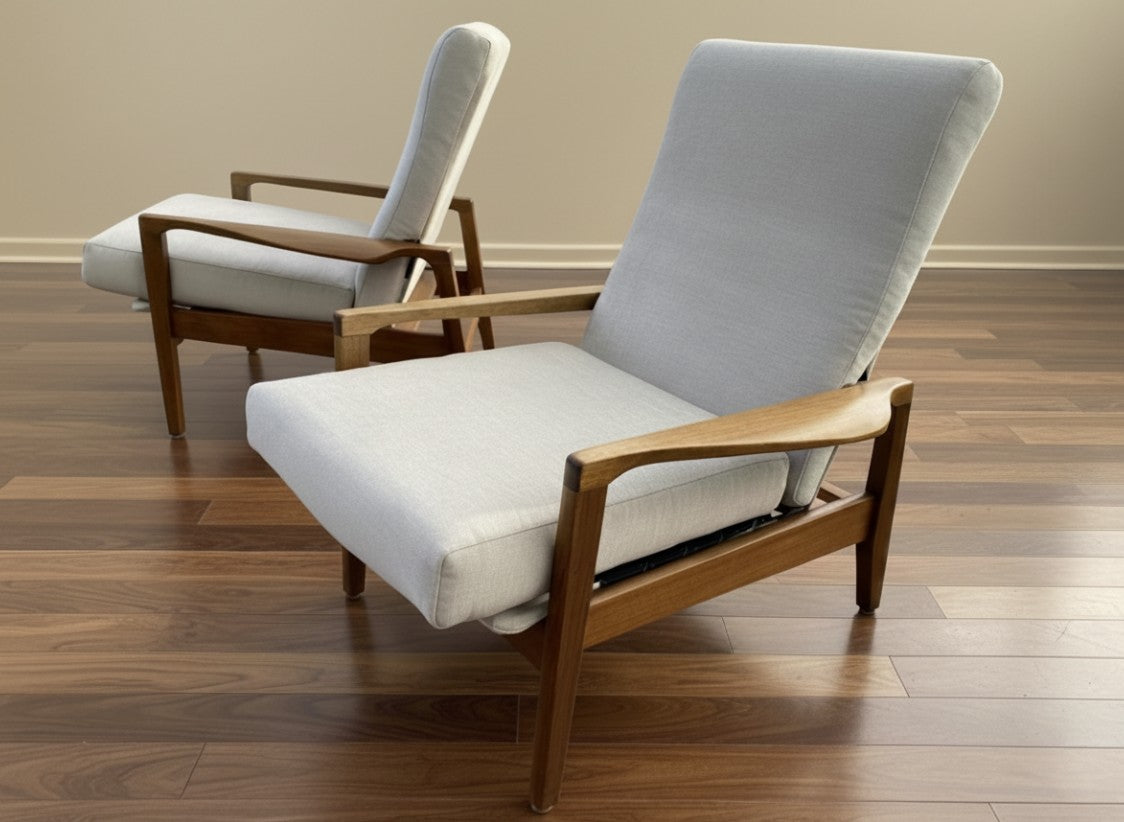 Two mid century chairs by Fred Lowen and Ernest Rodeck with wooden frames and gray cushions on a wooden floor. Fully Restored and for sale in Willoughby.