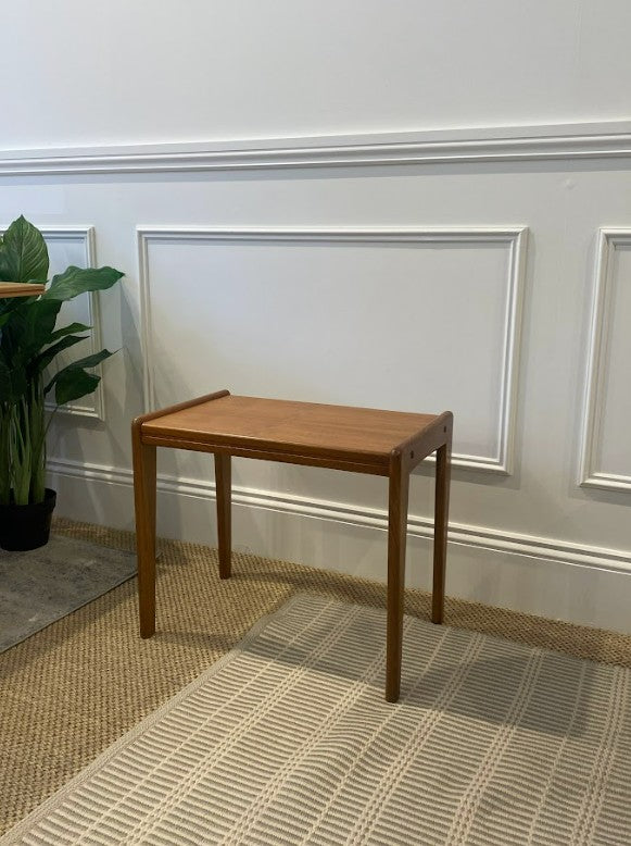 Mid century coffee table in a room with framed pictures on the wall and a plant. Available online or for viewing at Willoughby showroom. Ex Parker People™