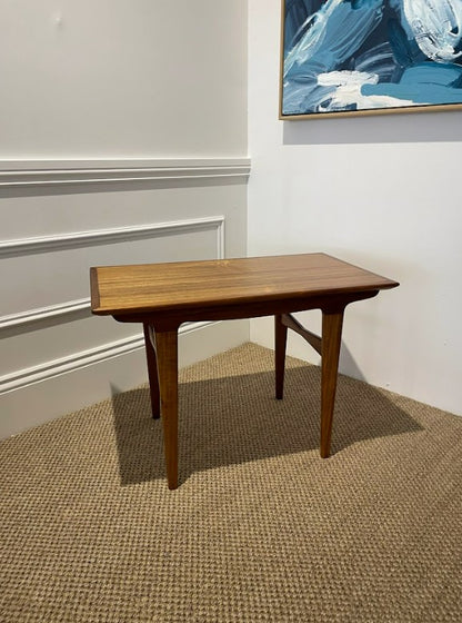 Wooden mid century table in a room with a textured floor and abstract painting on the wall. Online or visit Willoughby studio. Refurbishment by the Ex Parker People™.