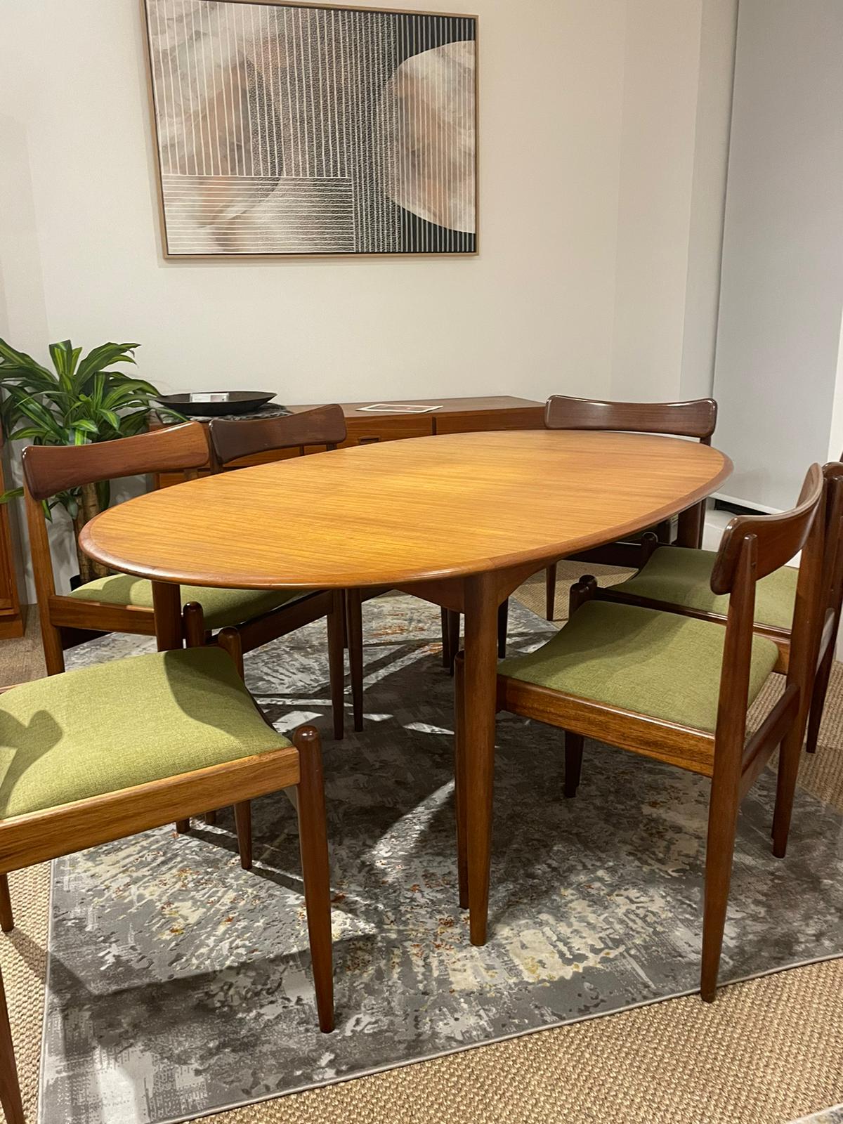 Parker furniture dining suite, featuring six parker 105 chairs and a dining table, model 91. Full restoration by the Ex Parker People™. Available for purchase in Sydney.