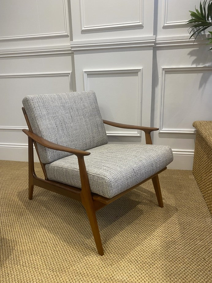 Restored Parker 155 armchair in textured fabric with sculpted timber frame and woven rattan back panel.