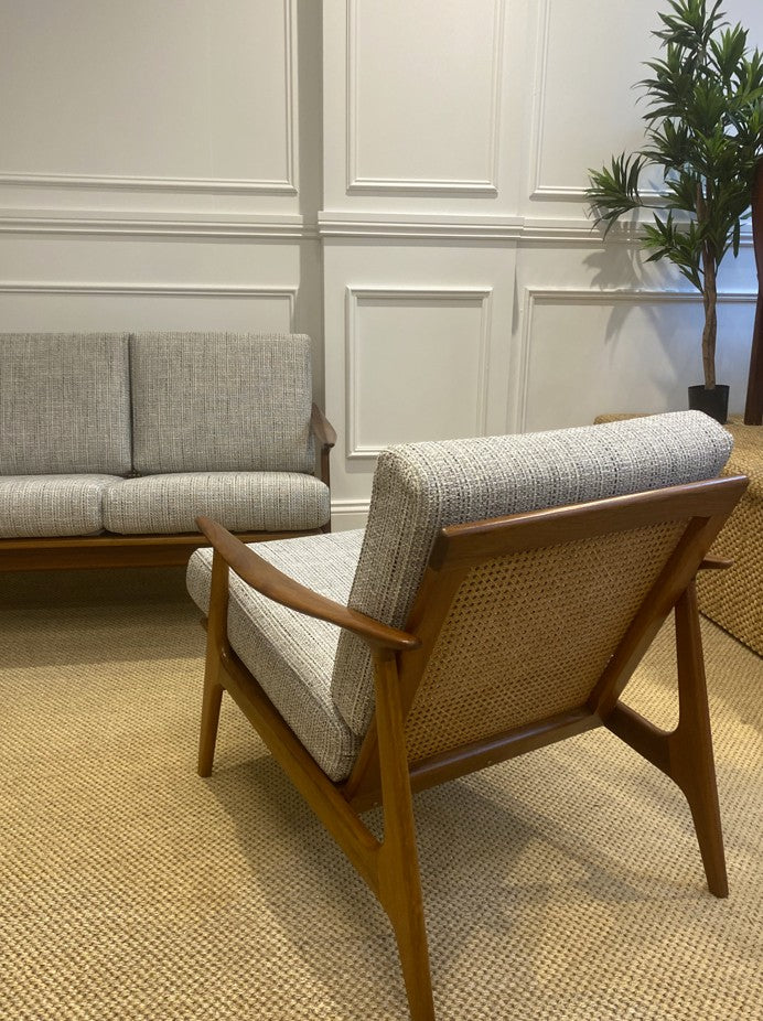 Vintage Parker 155 lounge chair with solid timber arms, woven rattan panel, and contemporary textured fabric.