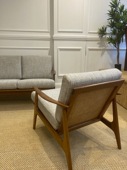Vintage Parker 155 lounge chair with solid timber arms, woven rattan panel, and contemporary textured fabric.