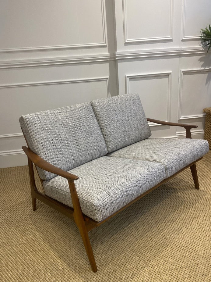 Restored Parker 157 two-seater lounge with teak frame and woven rattan back panel.