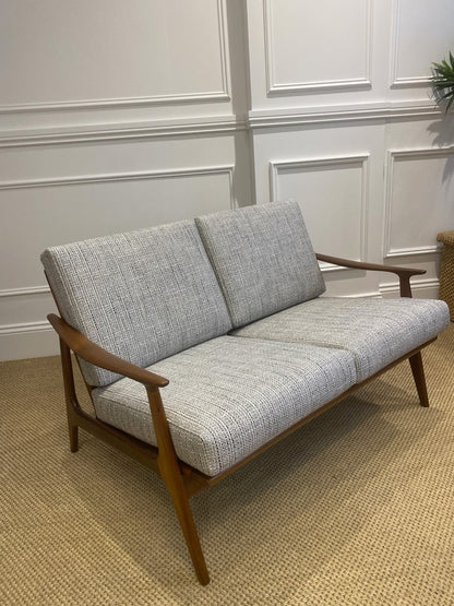 Restored Parker 157 two-seater lounge with teak frame and woven rattan back panel.