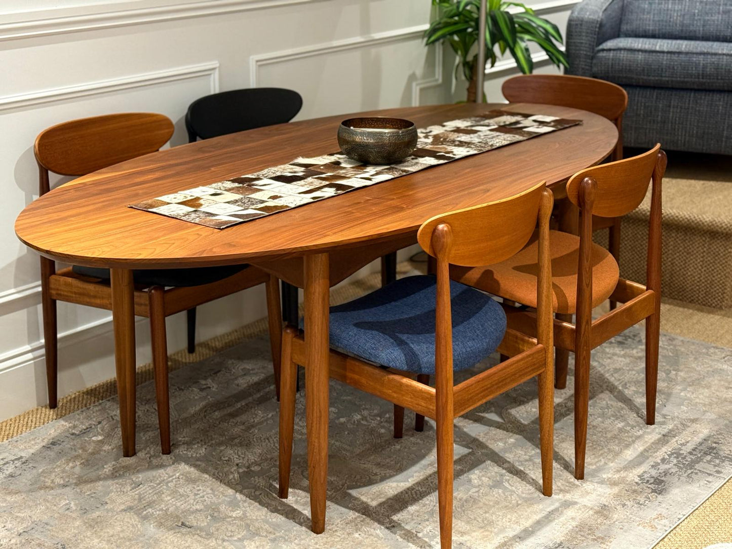 Wooden dining table with chairs in a room setting. This set is By Parker Furniture Australia. Restored By Parker experts, Covesmore in Sydney. Parker furniture for sale online or visit showroom.