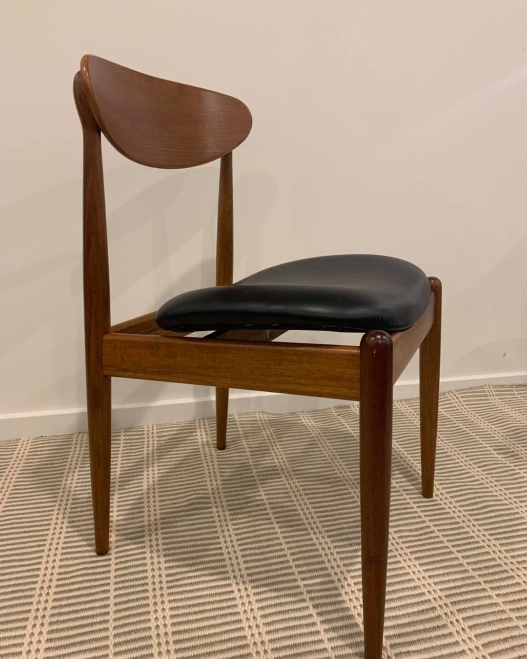 Side view of a Parker dining chair model 107, reupholstered in Black Leather. Full refurbishment by Covesmore Solutions.