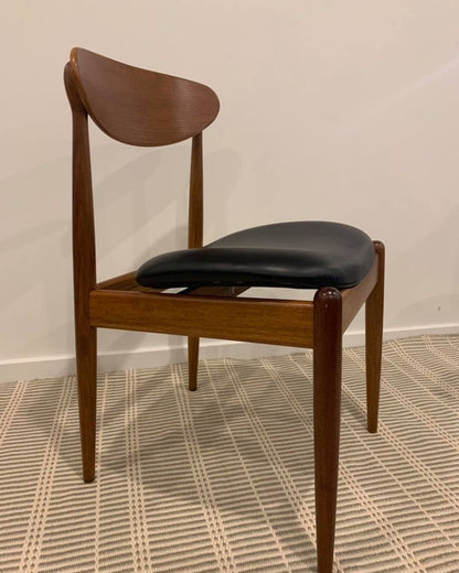Side view of a Parker dining chair model 107, reupholstered in Black Leather. Full refurbishment by Covesmore Solutions.